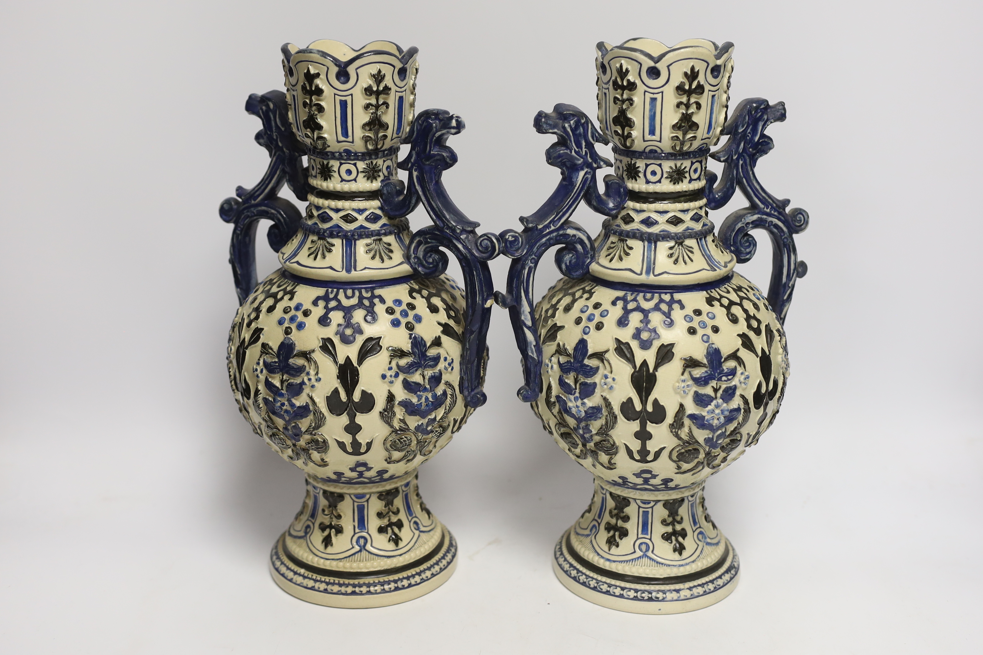 A pair of 20th century German pottery vases, 32cm